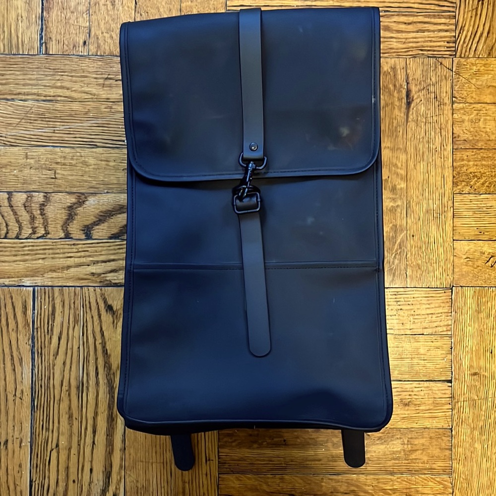 Rains waterproof black backpack.